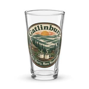 Gatlinburg and the Smokies Pint Glass: Gatlinburg. Less Hurry, More Mountain, Vintage Round Badge - 16 oz - Main