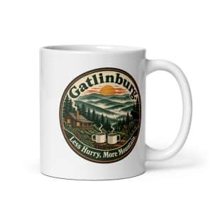 Gatlinburg and the Smokies White Ceramic Coffee Mug: Gatlinburg. Less Hurry, More Mountain, Vintage Round Badge - 11 oz - Main