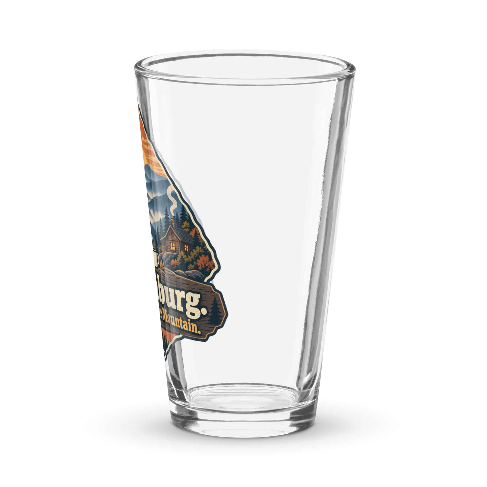 Gatlinburg and the Smokies Pint Glass: Gatlinburg. Less Hurry, More Mountain, Scenic Shield Badge