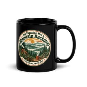 Gatlinburg and the Smokies Black Coffee Mug: My Vacation Has a Mountain Backdrop, Vintage Round Badge - 11 oz - Handle on Right