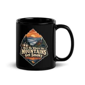 Gatlinburg and the Smokies Black Coffee Mug: Meet Me Where the Mountains Get Smoky, Scenic Shield Badge - 11 oz - Handle on Right