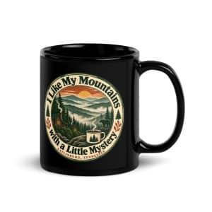 Gatlinburg and the Smokies Black Coffee Mug: I Like My Mountains with a Little Mystery, Vintage Round Badge - 11 oz - Handle on Right