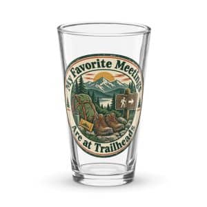 Nature and Adventure Pint Glass: My Favorite Meetings Are at Trailheads, Vintage Round Badge - 16 oz - Main
