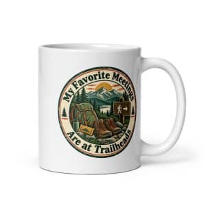 Nature and Adventure White Ceramic Coffee Mug: My Favorite Meetings Are at Trailheads, Vintage Round Badge - 11 oz - Main