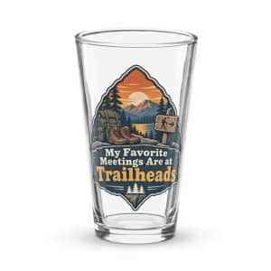 Nature and Adventure Pint Glass: My Favorite Meetings Are at Trailheads, Scenic Shield Badge - 16 oz - Main