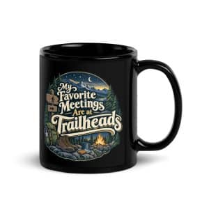 Nature and Adventure Black Coffee Mug: My Favorite Meetings Are at Trailheads, Woodland Scenic Lettering - 11 oz - Handle on Right