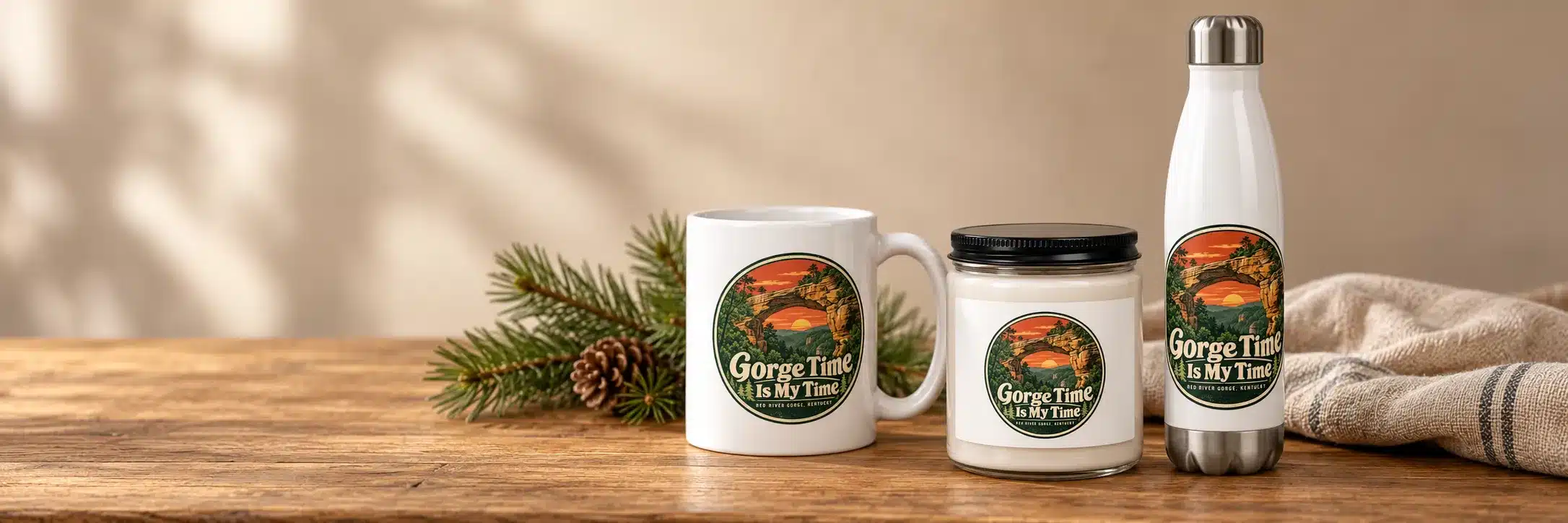 Gorge Time Is My Time mug, candle and water bottle on a wooden table with a pinecone
